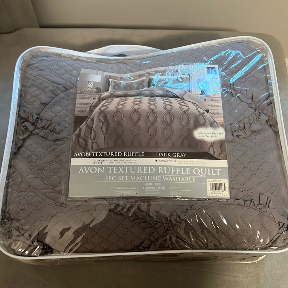 BRAND NEW, NEVER OPENED. Avon textured quilt in dark gray for FULL/QUEEN beds.